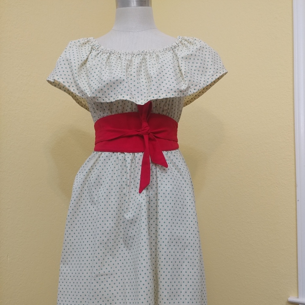 Shoulder off dress with wide red belt